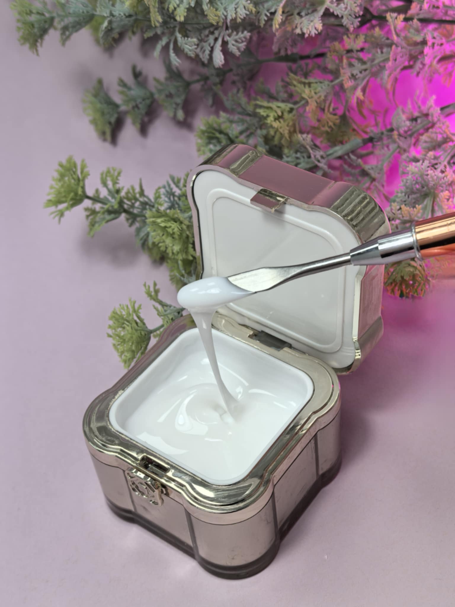 Lemmy Builder Gel 16 - Milky White in an open container with spatula against a floral background