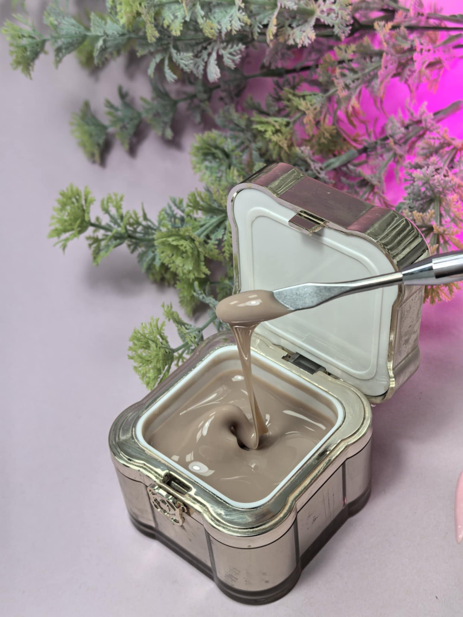 Lemmy Builder Gel 22 - Cappuccino in elegant pot with cream-like texture being scooped, ideal for salon-quality nail enhancements.