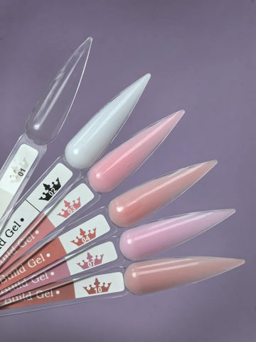 Nail tips with various shades including clear, featuring Lemmy Builder Gel 01 - Clear 15ml for manicure applications.