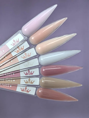 Variety of nail colors on display including Lemmy Builder Gel 15 - Malibu Peach 15ml, ideal for natural nails and salon lengths.