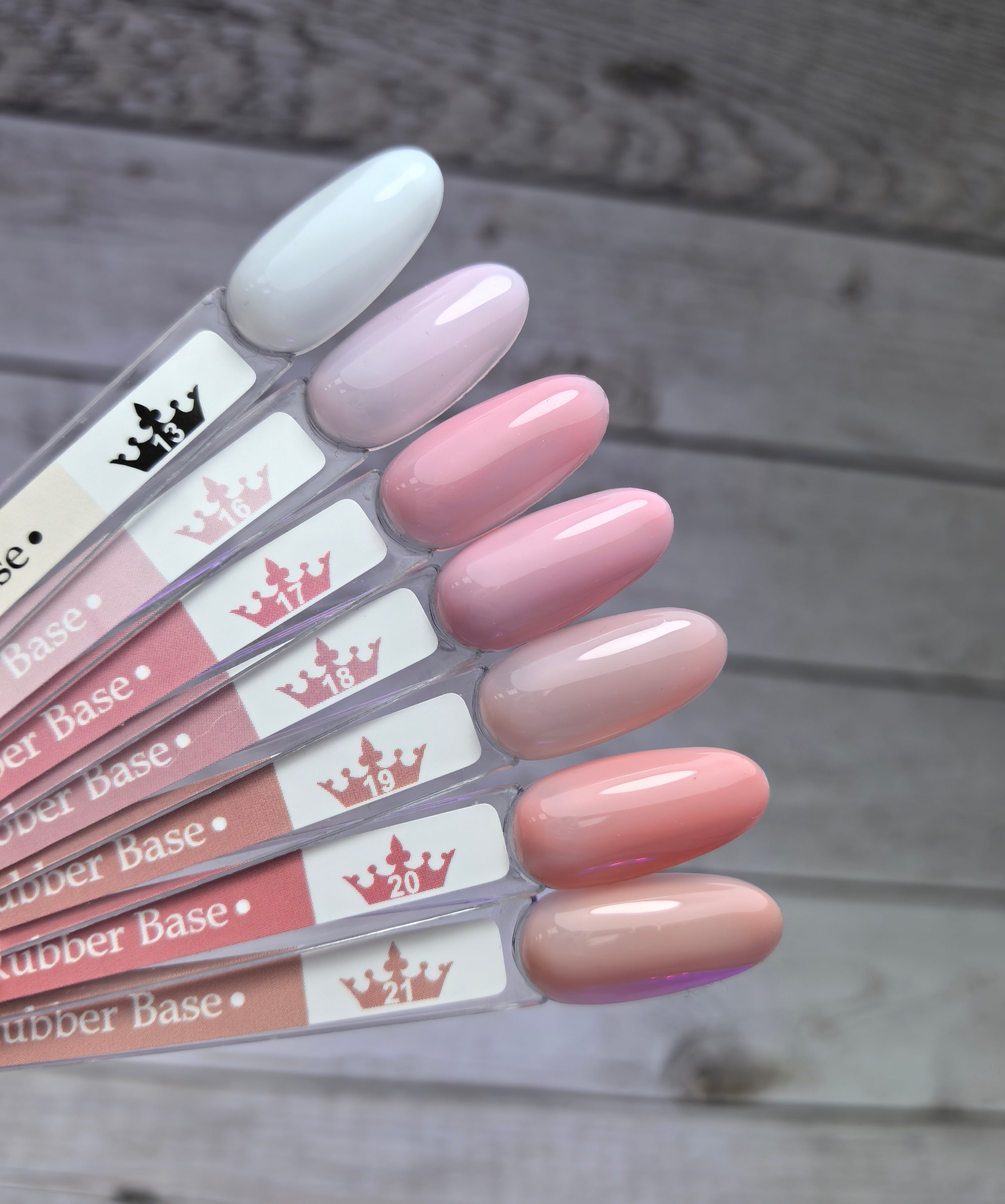 Nude Rubber Base 17 swatch display showing various pink and nude shades on nail testers.